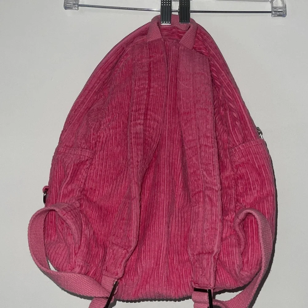 Pink urban outfitters corduroy backpack